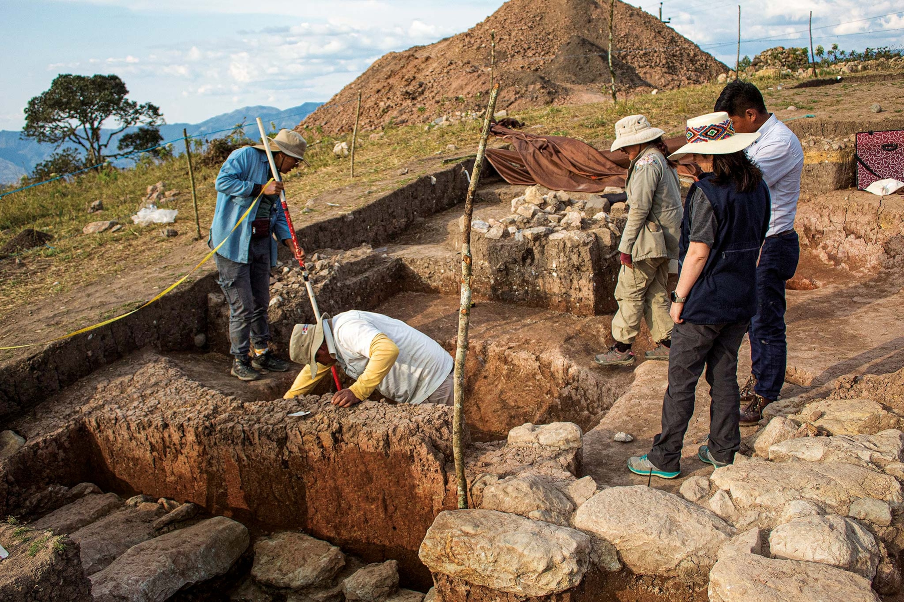 Workers carefully excavate the tomb of the Priest of Pacopampa