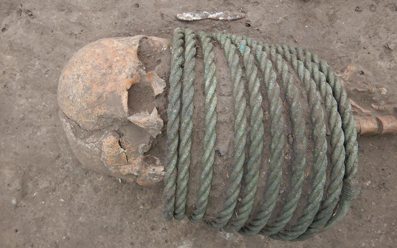 1,000-year-old cemetery with dead wearing elaborate neck rings and buckets on their feet unearthed in Ukraine