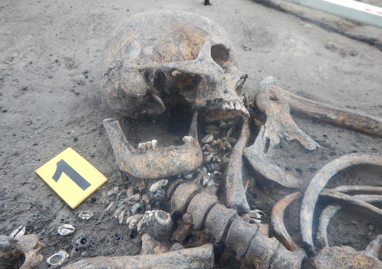 1,000-year-old cemetery with dead wearing elaborate neck rings and buckets on their feet unearthed in Ukraine