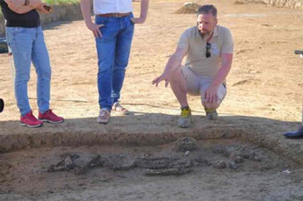 Archaeologist Florian Eibl from Dingolfing-Landau district beside the skeleton at the excavations at the village of Exing, near the Bavarian town of Eichendorf. (Dingolfing-Landau District)