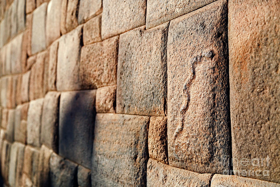 Inca wall and carved stone snake Cusco Peru by James Brunker